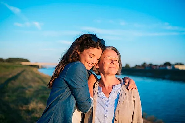 mum and daughter hugging